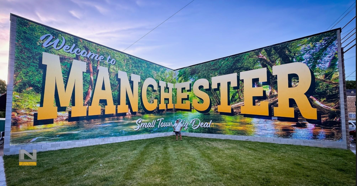 The Welcome to Manchester mural — Small Town, Big Deal